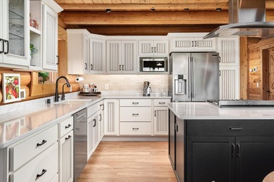 This custom log home was professionally designed and built in - photo 12
