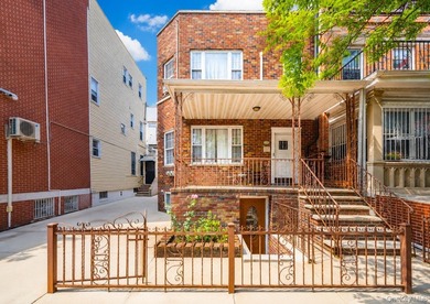 Located in Dyker Heights! Semi-attached 2-dwelling brick home on - photo 2