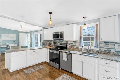 Effortless lakefront living meets income potential--welcome to