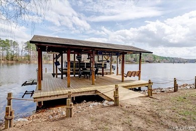 Effortless lakefront living meets income potential--welcome to