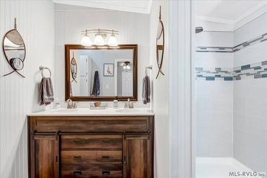 Effortless lakefront living meets income potential--welcome to