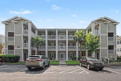 This updated second-floor, 3-bedroom, 2-bath condo overlooks the - photo 1