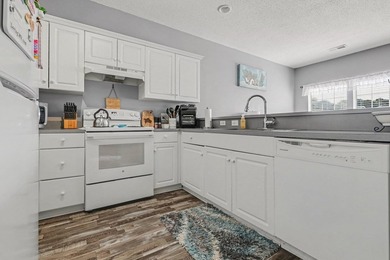 This updated second-floor, 3-bedroom, 2-bath condo overlooks the - photo 8