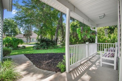 Tucked beneath a canopy of mature trees in the gated community - photo 6