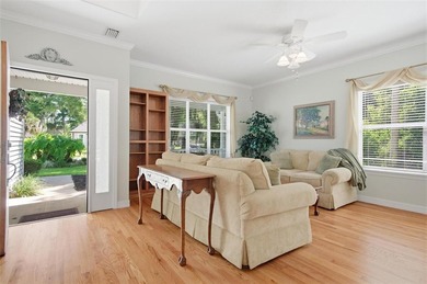 Tucked beneath a canopy of mature trees in the gated community - photo 7