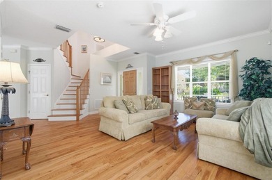 Tucked beneath a canopy of mature trees in the gated community - photo 8