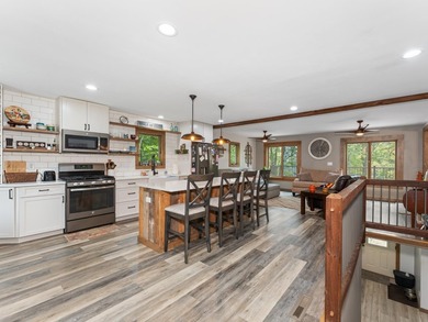 Enjoy this 3 bdrm. 3.5 bath lakefront single story home with - photo 4