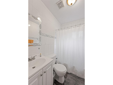 Discover this exceptional three-family property in one of - photo 12