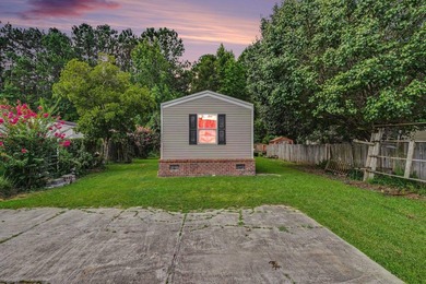 Affordable coastal living awaits in Baywood Estates! Located in - photo 1