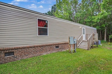 Affordable coastal living awaits in Baywood Estates! Located in - photo 3