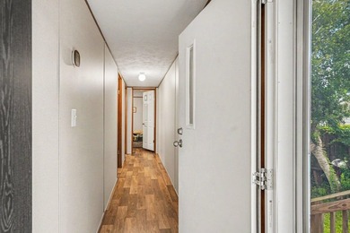 Affordable coastal living awaits in Baywood Estates! Located in - photo 4