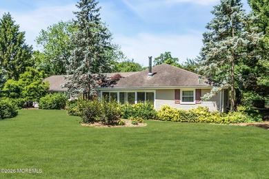 Nestled on 1.59 acres of beautifully landscaped property, this - photo 1