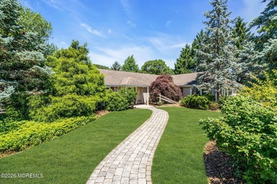 Nestled on 1.59 acres of beautifully landscaped property, this - photo 3
