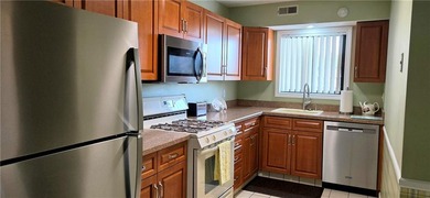 Immaculate move in ready two bed, two bath condo in popular