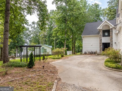 Set along the shores of Lake Lanier, this thoughtfully designed - photo 6