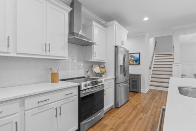 Built in 2023, this like-new home combines modern design - photo 8