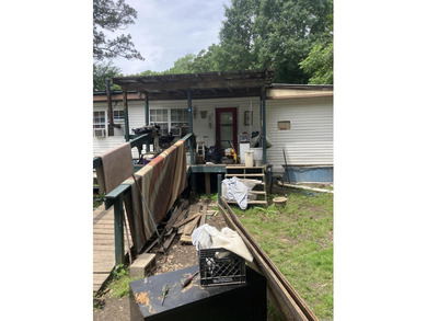 Tucked away on approximately 1 acre, this versatile manufactured - photo 2
