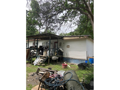 Tucked away on approximately 1 acre, this versatile manufactured - photo 3