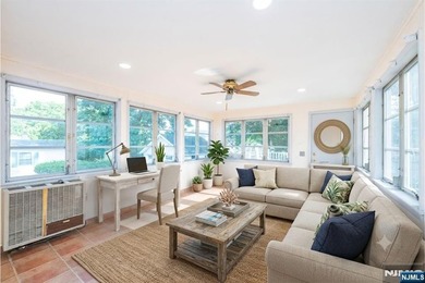 This income-producing two-family home lies in the heart of - photo 8