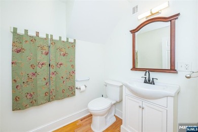 This income-producing two-family home lies in the heart of - photo 10