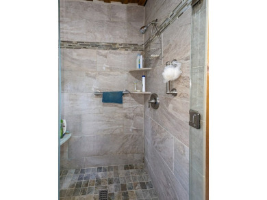 Step into timeless mountain living with this 3-bedroom, 3-bath