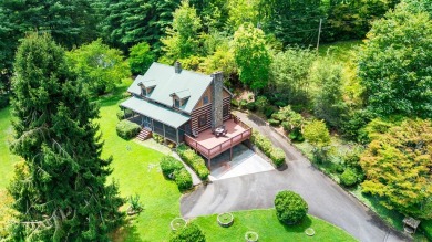 Step into timeless mountain living with this 3-bedroom, 3-bath