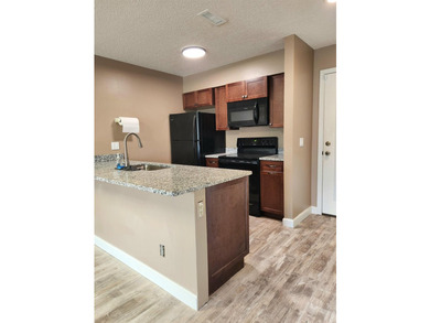 Rarely available, this beautifully updated third-floor condo - photo 3
