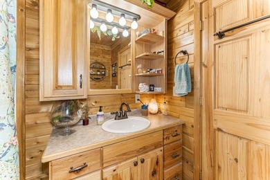 Set on 1.19 wooded acres in the heart of Sugar Camp, this 1,746 - photo 9