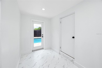 This fully updated St. Petersburg corner lot pool home delivers - photo 22