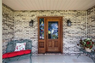 A welcoming front porch and stunning, custom stained-glass front - photo 2