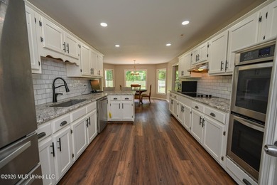 Nestled on a stunning 3.7-acre treed lot complete with a private - photo 13