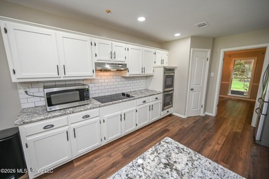 Nestled on a stunning 3.7-acre treed lot complete with a private - photo 16