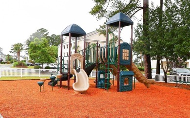 Welcome to 4990 Windsor Green Way, Unit 102, a first-floor condo