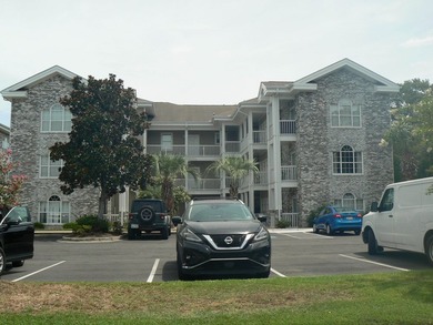 Enjoy the convenience of this 1st floor corner unit! Close to - photo 1