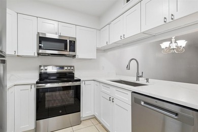 Welcome to Trafalgar Square and this updated 2-bedroom - photo 3