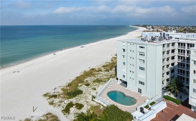 Experience true beachfront living in this stunning corner-unit - photo 2