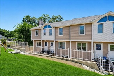 Enjoy the ease of one-level living in this desirable end-unit - photo 1