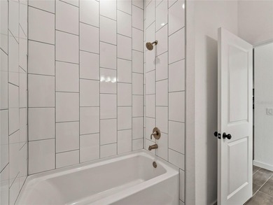 Tile throughout. Quartz countertops. Impact windows. Paver - photo 22
