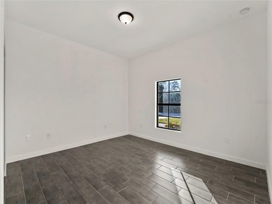 Tile throughout. Quartz countertops. Impact windows. Paver - photo 23