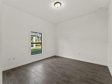 Tile throughout. Quartz countertops. Impact windows. Paver - photo 27