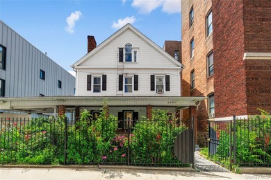 Welcome to 2281 Loring Place North, a spacious two-family home - photo 1