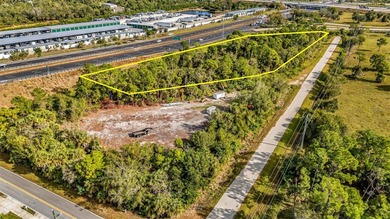 This commercial lot offers excellent visibility and a strong - photo 1