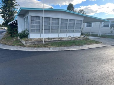 REDUCED PRICE! Situated on a generous corner lot in this 55+ - photo 2