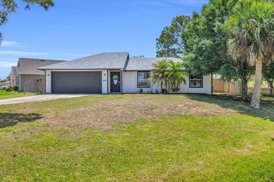 Welcome home to this Sebastian Highlands property, situated on a - photo 1