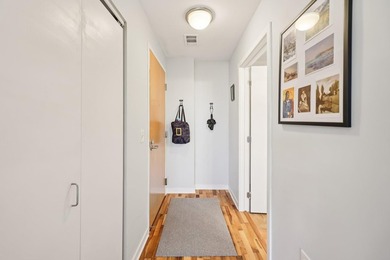 This Skyscape single-level end-unit condo offers the privacy and - photo 13