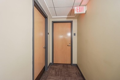 This Skyscape single-level end-unit condo offers the privacy and - photo 23