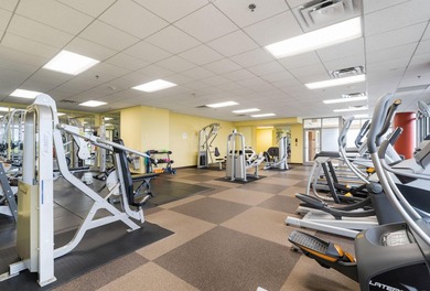 This Skyscape single-level end-unit condo offers the privacy and - photo 27