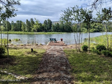 Nestled among mature trees in a private waterside setting, this - photo 50