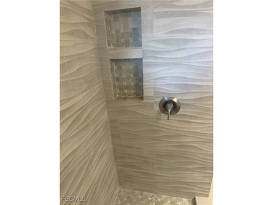 This premier fountain view, private elevator, spacious two-car