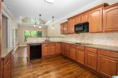 Private lake living at its finest! Tucked away on a wooded lot - photo 11